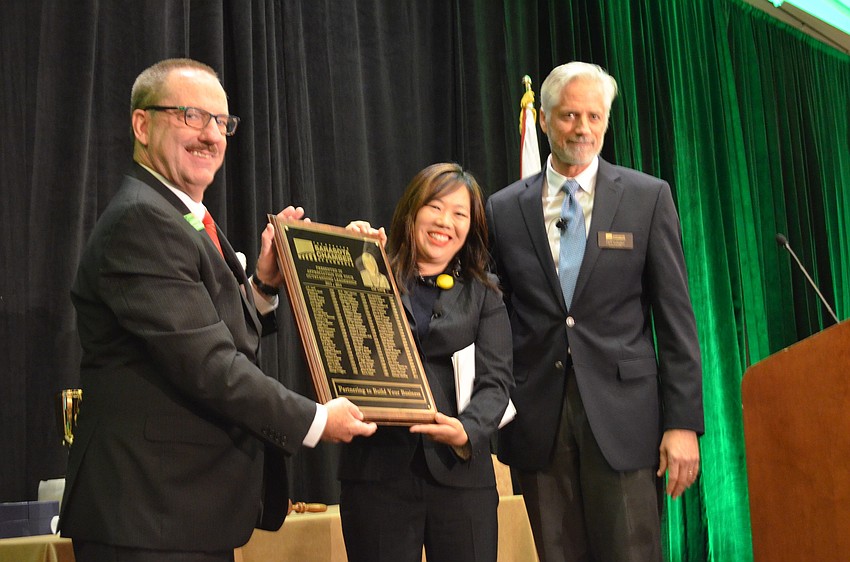 Lisl Liang is recognized for her time as Board Chair after passing the gavel to incoming chair Chris Gallagher.