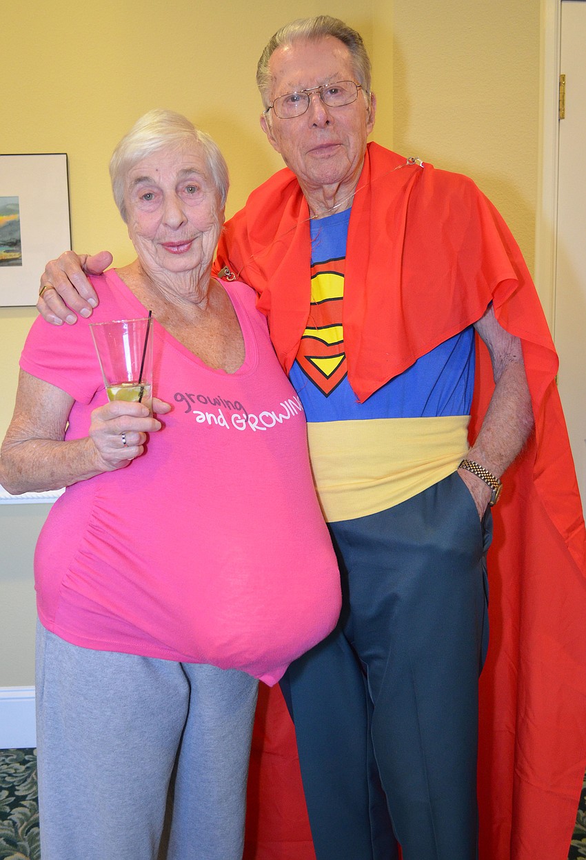 Sue and Sandy Fidgar dress as a pregnant Lois Lane and Superman.