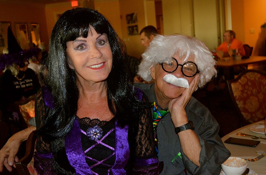 Maria Todd and David Whistler cuddle up during dinner.
