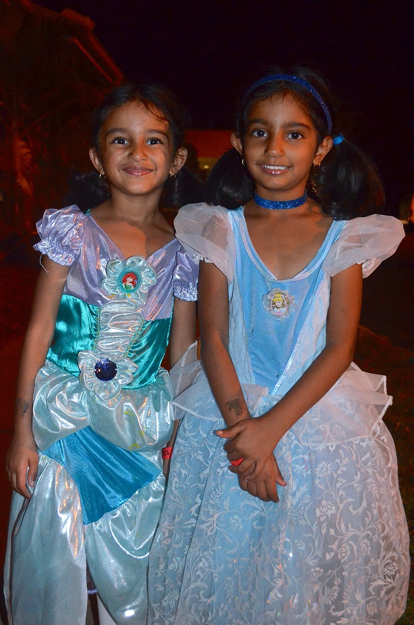 Sisters Maarya and Hannah Harianawalla wear matching smiles, but play different princesses.