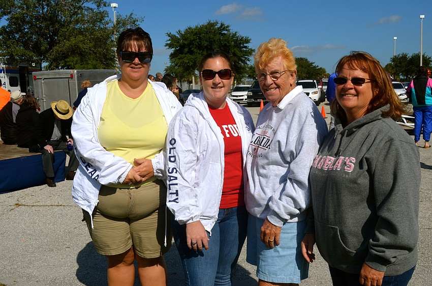 Jamie Spencer, Crista McGraw, Janice Spencer and Jill McGraw watch the competition form the sidelines.