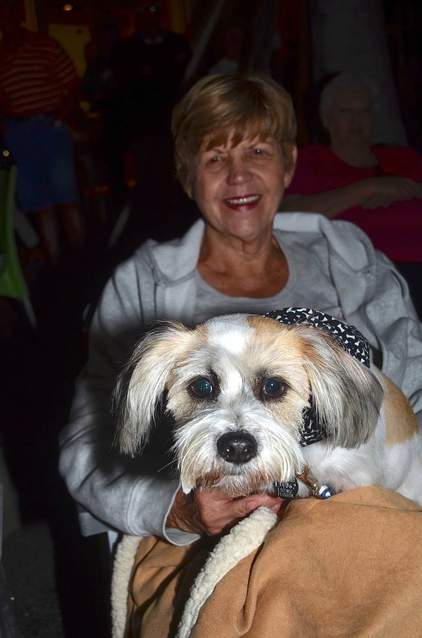 Maryanne Lalonde and her furry friend, Riley, enjoy the music.