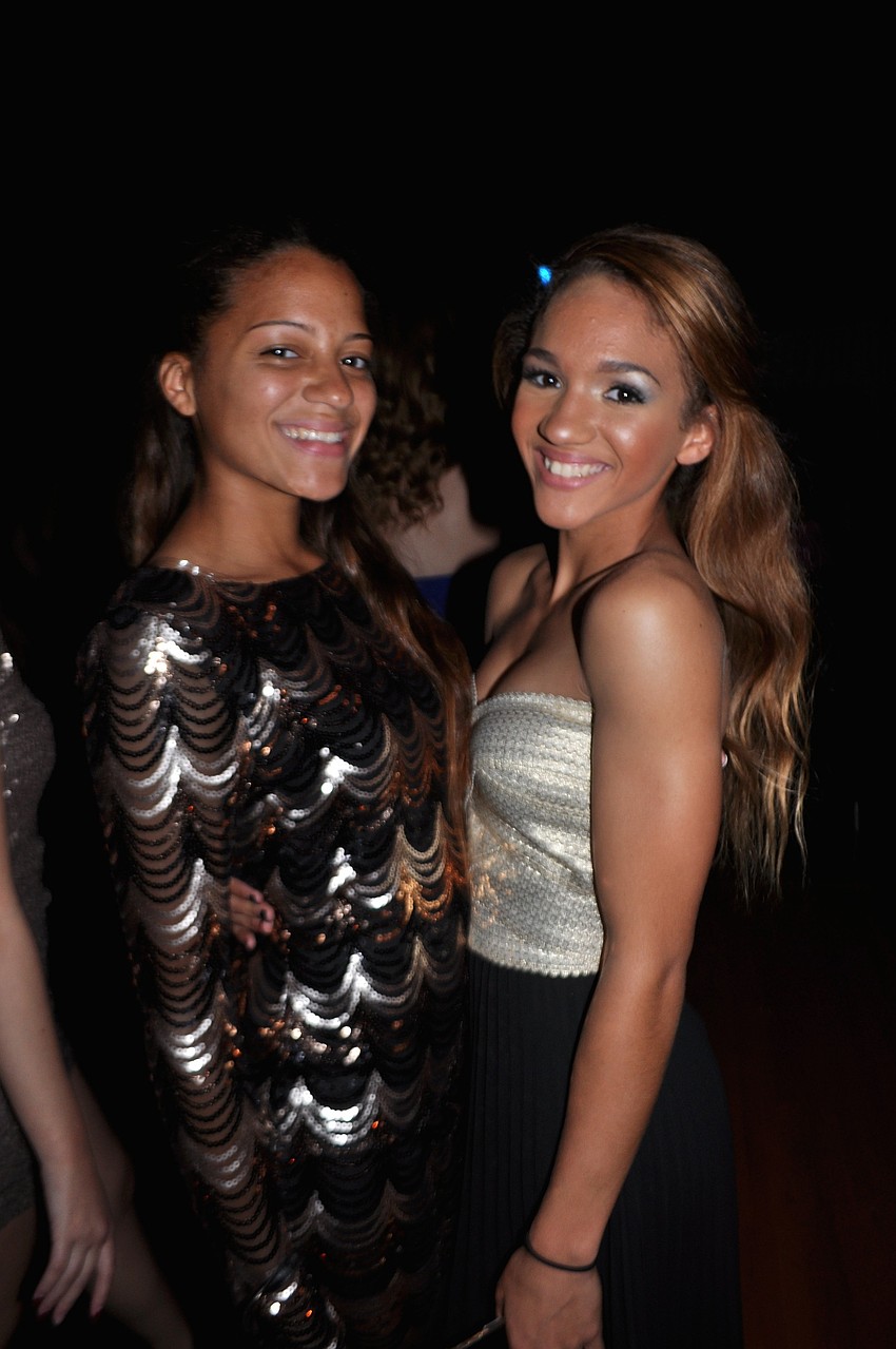 Sisters Alexis and Miya Yawn make sure to take a photo together.