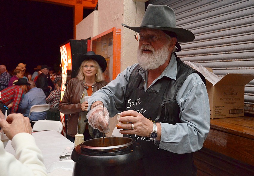 Bob Kirsher serves chili at the Siesta Key Chamber of Commerce Sandfest.