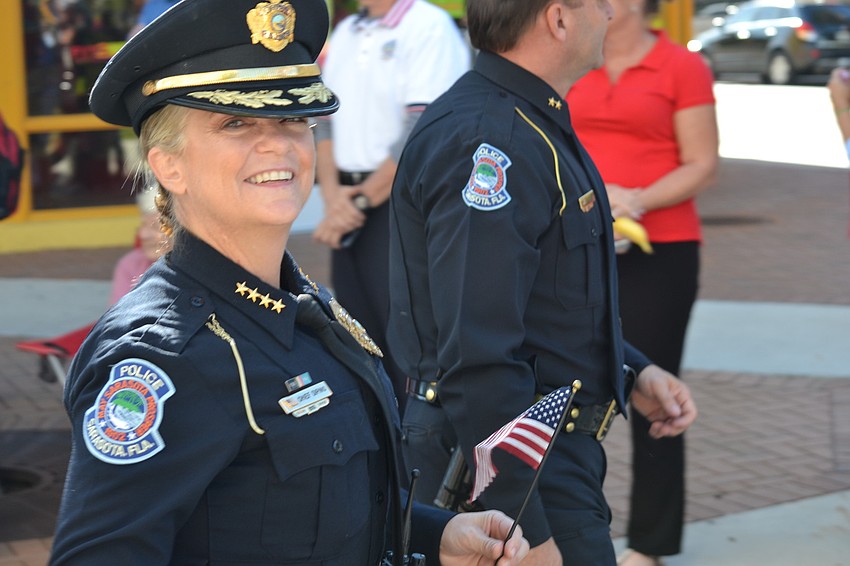 Sarasota Chief of Police, Bernadette DiPino helps lead the parade down Main Street.