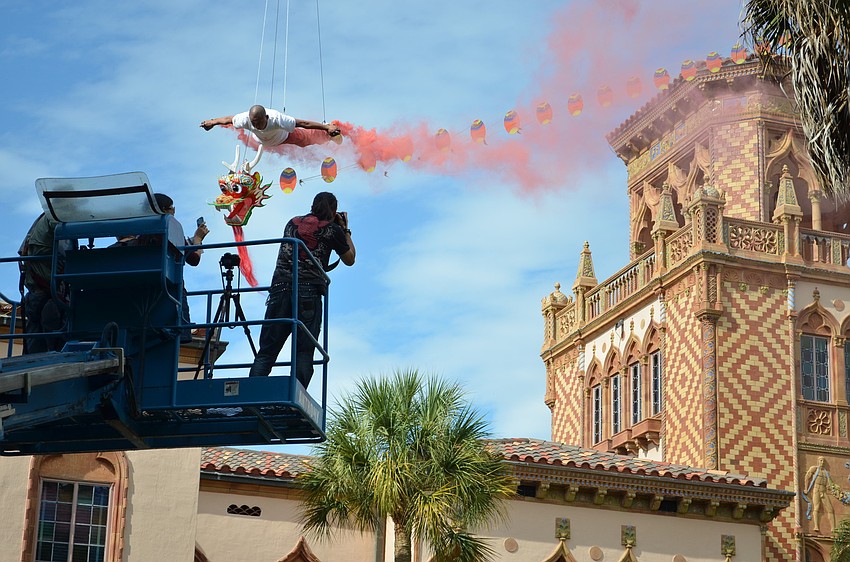 Li Wei tenses up so his photographer can capture his flight at the right angle.