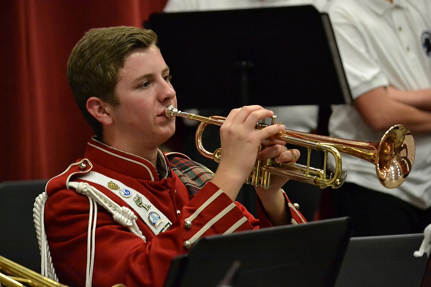 Riverview High School junior, Justin Patterson warms up before the fall concert.