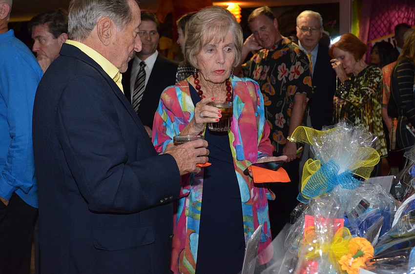 Bob and Pat Frazier browse the silent auction items on display.