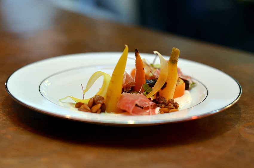Chef Paul Anders, from Sweet Basil and Mountain Standard in Vail, Colorado, preparers the first course: Carrot Variations, with Ricotta and Smoked Trout Roe