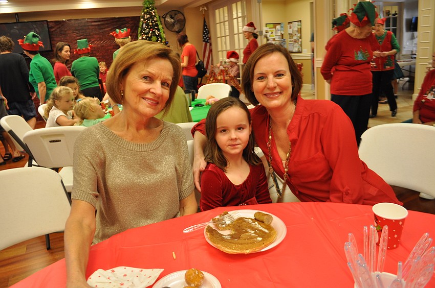 Heritage Harbour residents Rose Vinopal brings her granddaughter and daughter, Emma and Kim Brown, of Tampa.