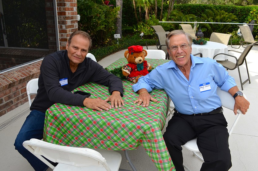 Nick Mastro and Arnold Rahman enjoy chatting while their wives mingle as well.
