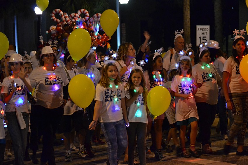 Members of the Florida Studio Theatre walk in the Downtown Sarasota Holiday Parade.