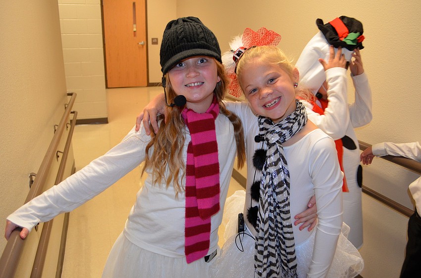 Emorie Lawrence and Abigail Burwood share laughs backstage.