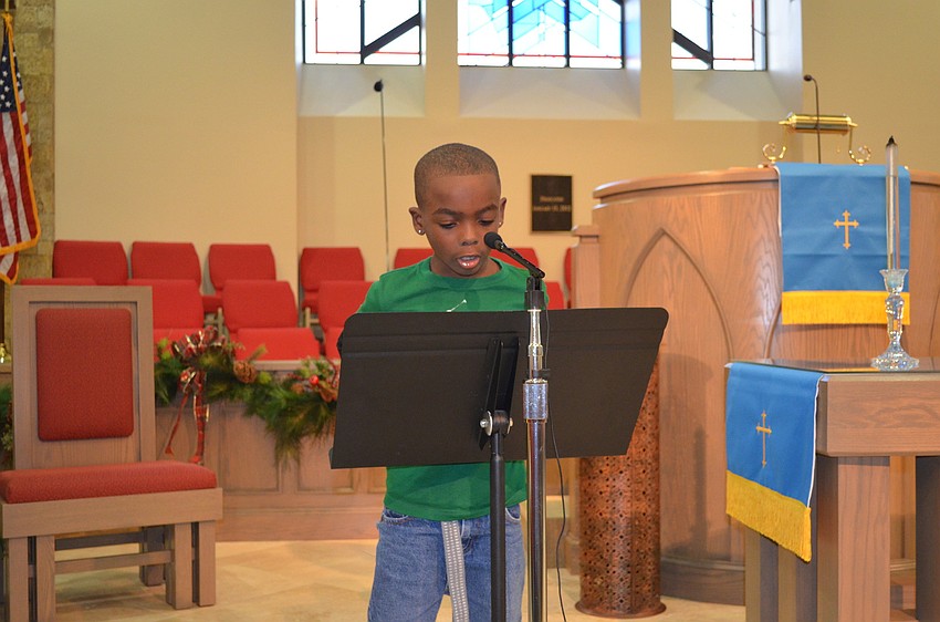 The students sing Christmas carols to their buddies.