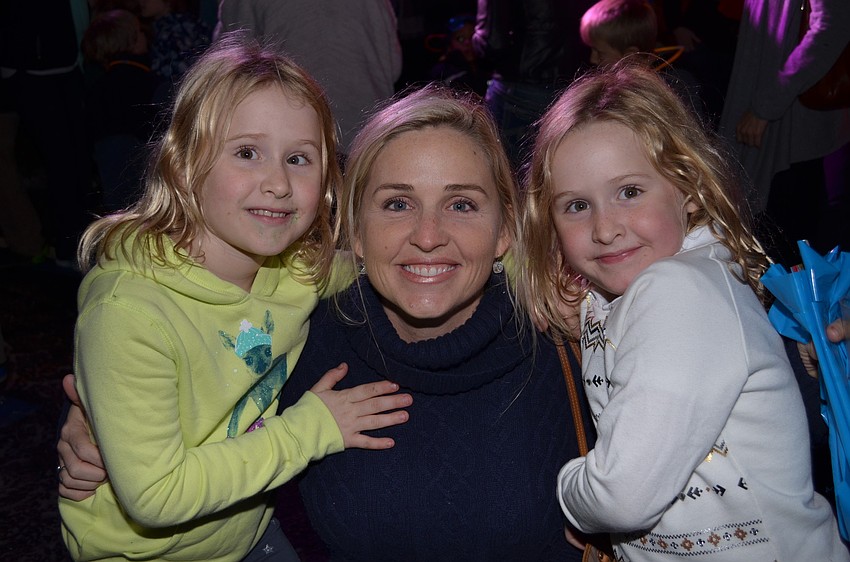 Jenn McAlister enjoys the Southside Village Holiday Stroll with her daughters Jaidyn and Kaitlyn.