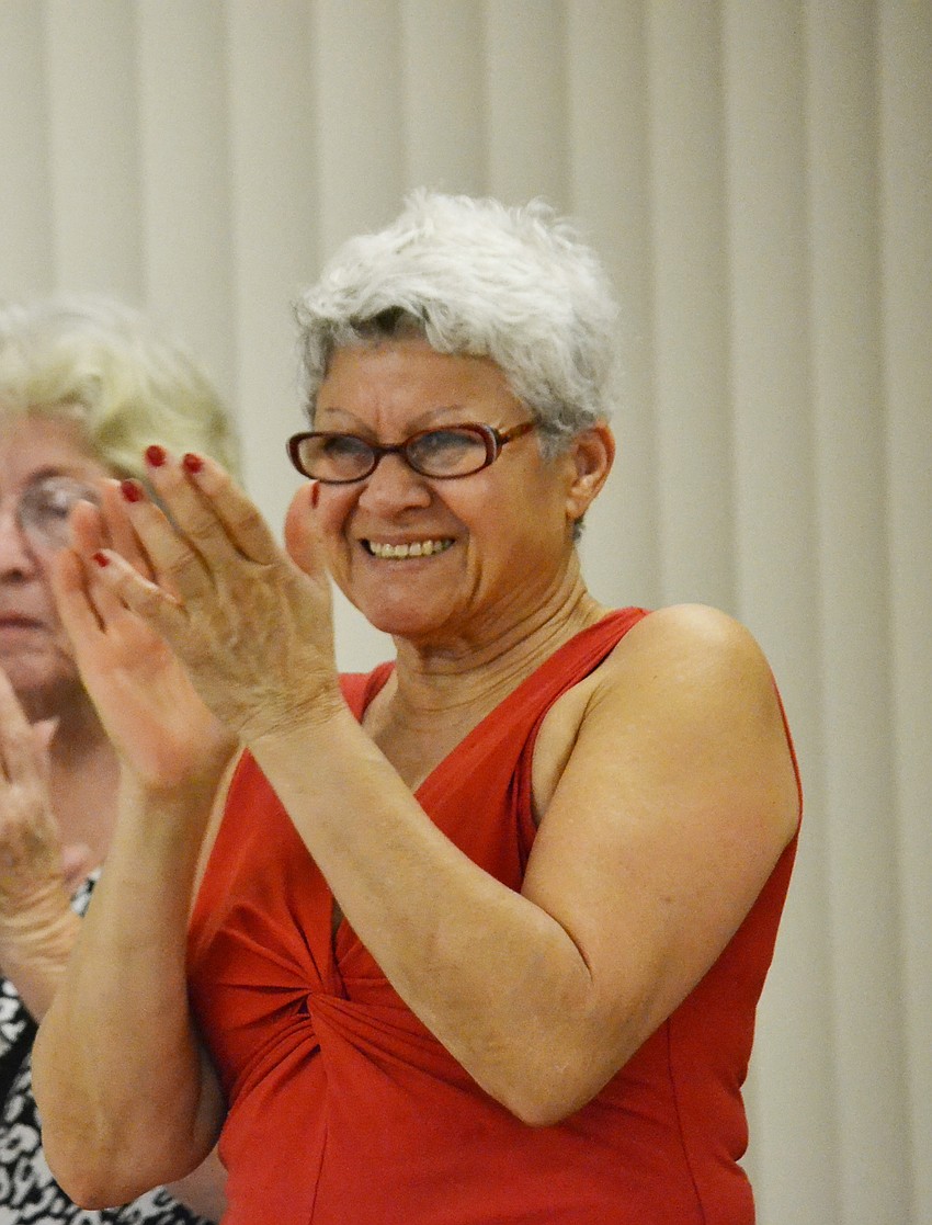 Barbara Shepherd cheers on students during a performance.