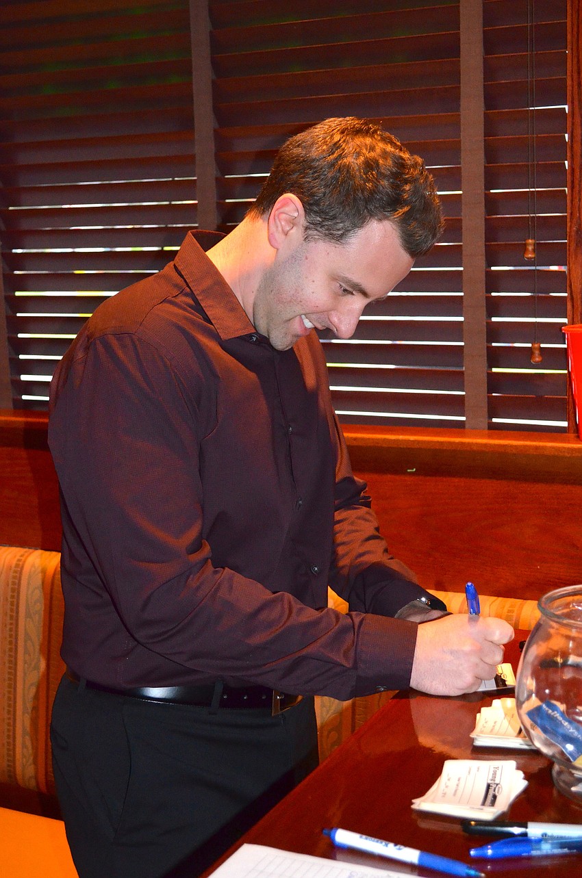 Doug Hange checks in before meeting with friends.