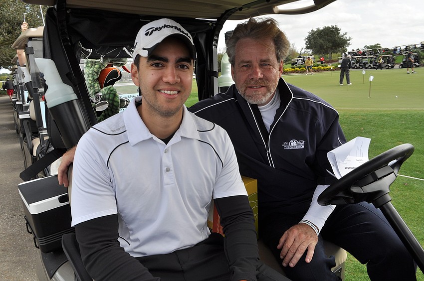 Nathan and Keith Feldhacker golf together.