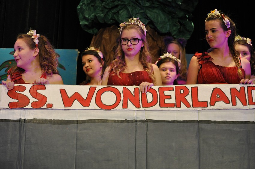 Hailey Huber, Ronni Belser and Avery Goelz ride a boat.