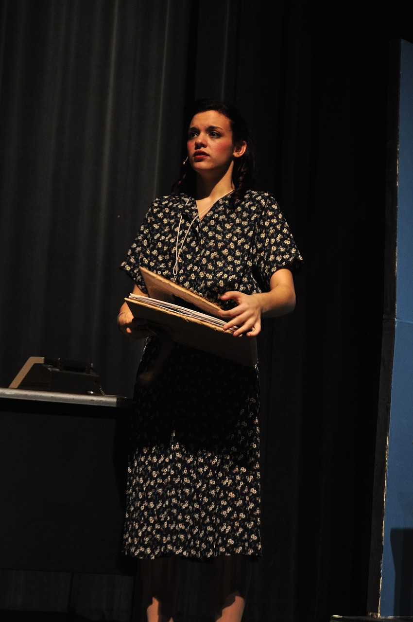 Jessica Gulbrandsen, asÂ Gladys Hotchkiss, Mr. Hasler's secretary, keeps a tight guard over the key she wears around her neck.
