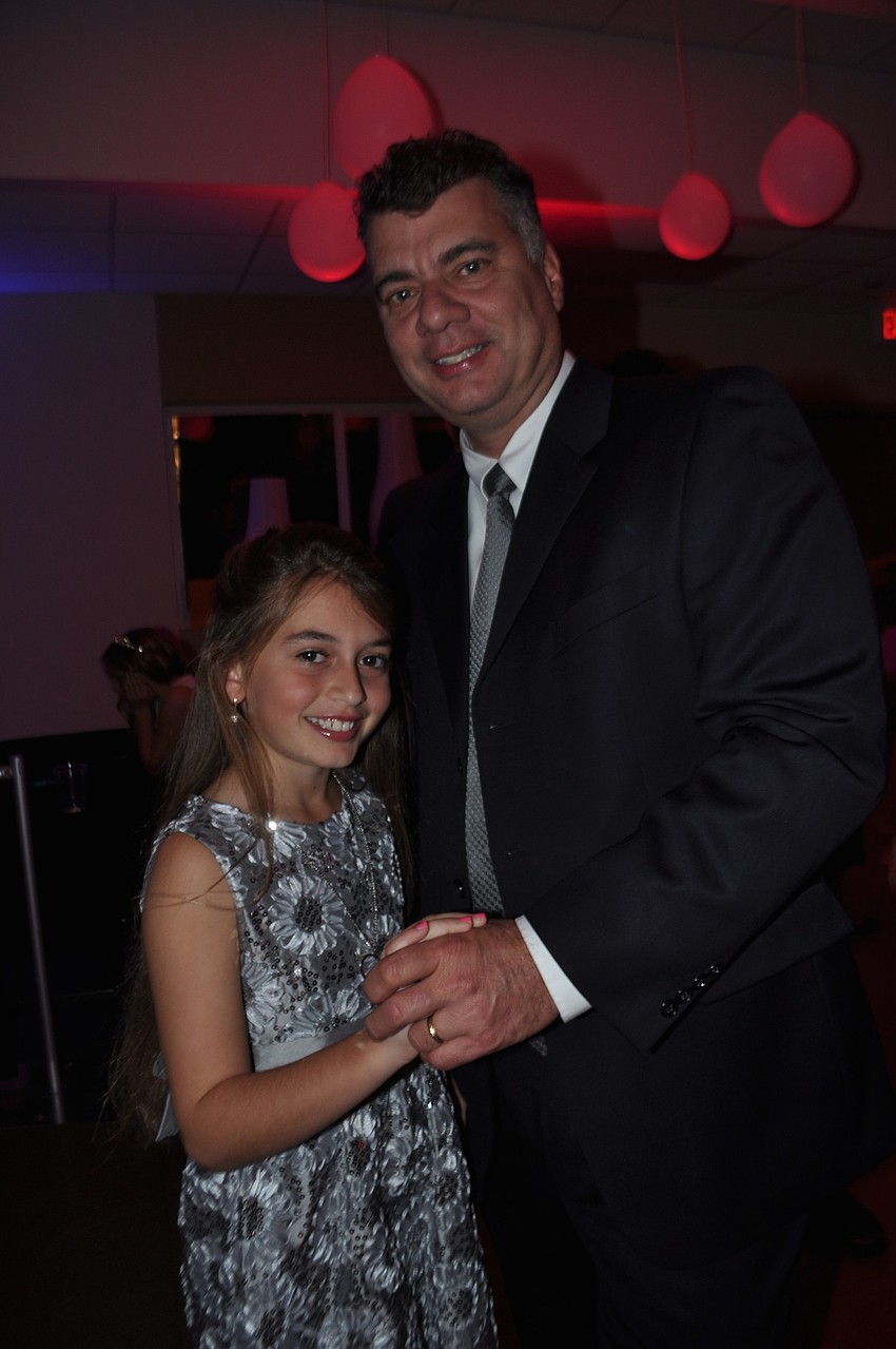 Jessica and Doug Wagner dance a slow dance.