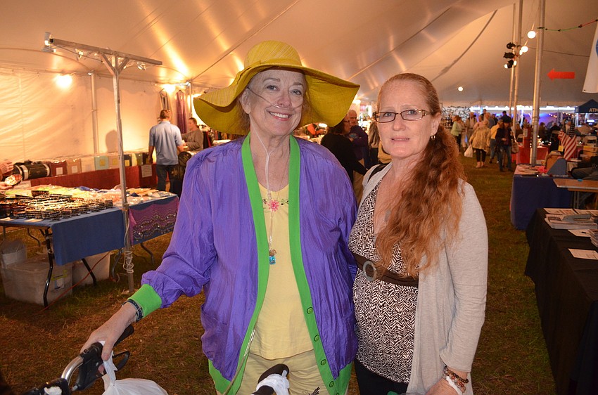 Joy Mohnet and Joy Bryant browse inside of theGreek marketplace.