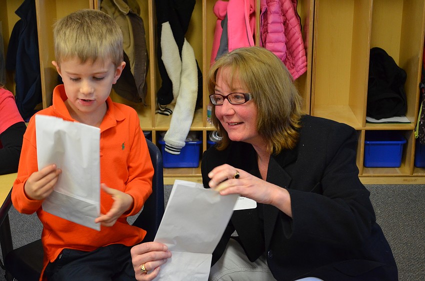 Jeffrey Horr gives his grandmother Donna Neary a present he helped make in class.