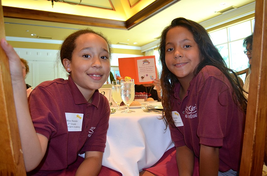 Natalie Burgett-Swafford and Vanessa Hernandez wait for their meals to arrive.