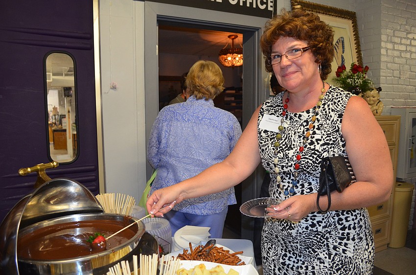 Lisa Parker tries some chocolate fondue.