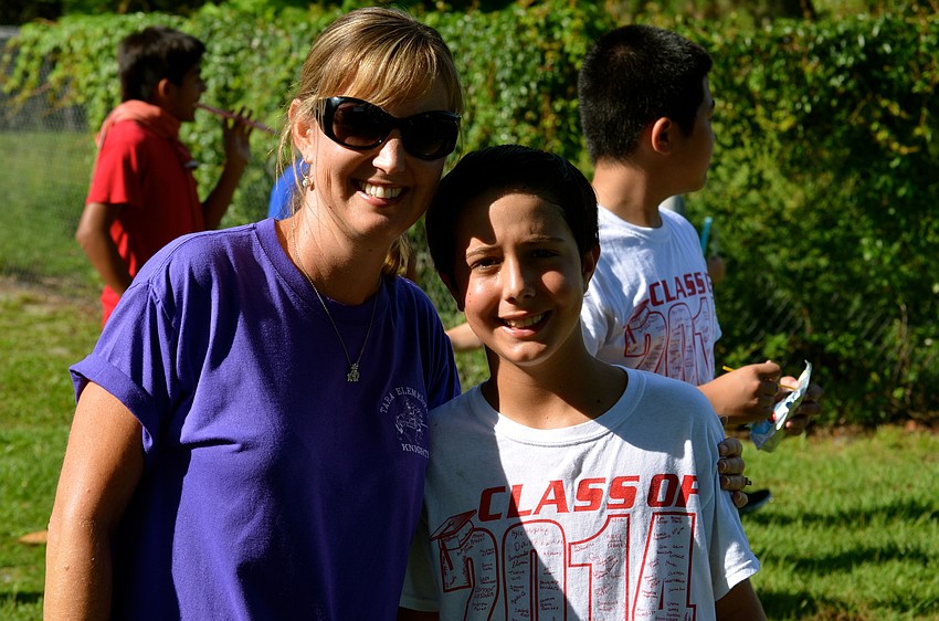 Cari Losada smiles beside her son, Connor â€” the last of the Losada children to attend Tara.