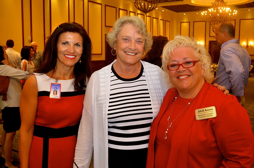 Senator Nancy Detert stands flanked by Violeta Huesman and School Board Chairwoman Julie Aranibar.