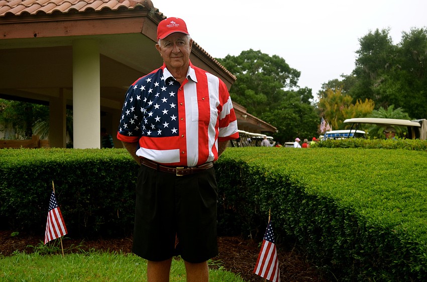 John Grey personifies the American flag.