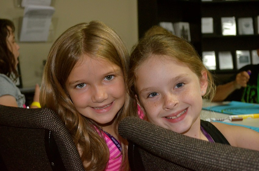 Elianna Smith and Sophia Clauson enjoy girls' time and crafts.