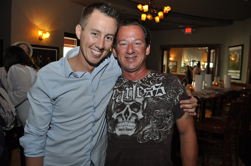 Andrew Hibbert and Dave Neff enjoy the Cajun cuisine.