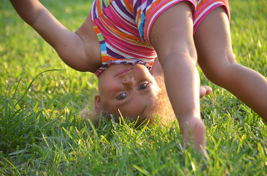Aubrey Mitchell plays in the grass at Bayfront Park.