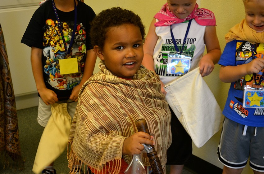 Zay Washington acts out a Bible story.