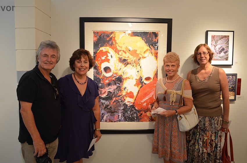 Dieter Lau, Judy Saltzman, Patty Sarlo and Joanne Pattison in front of Saltzman's watercolor piece 