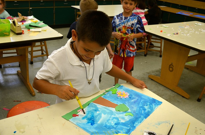 Kian Martinez paints.