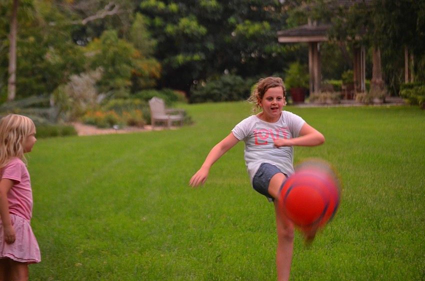 Catherine Shultz kicks the ball.