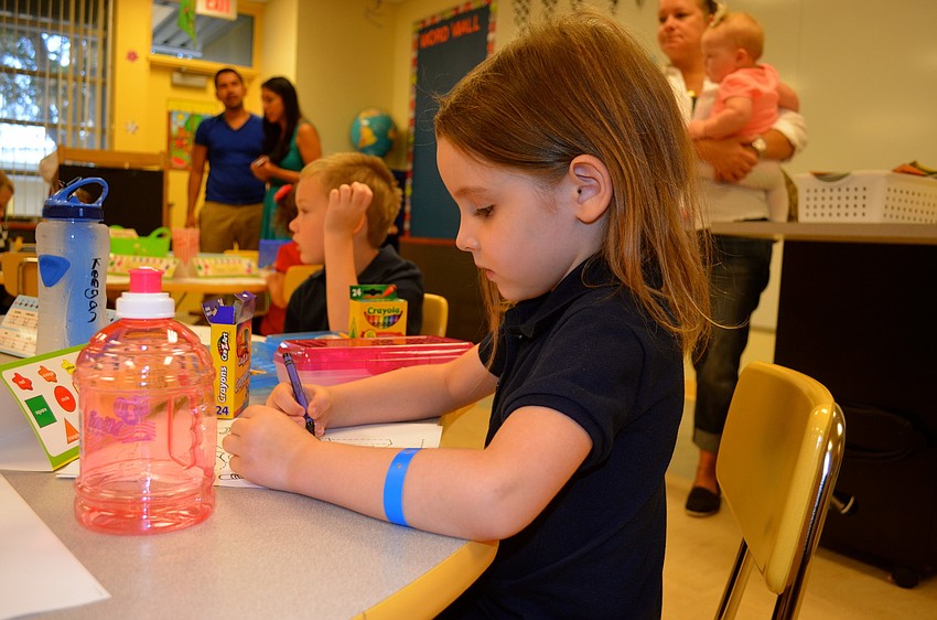 Faith Shepard concentrates on coloring.