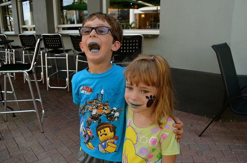 Gavin and Abigail Messner goof around outside.
