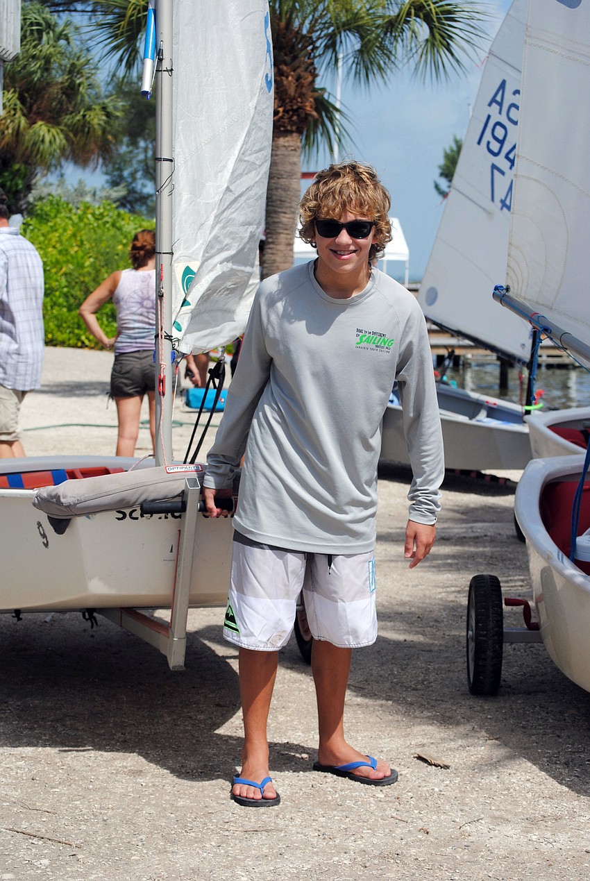 Charles Nichols wheels his boat to the shoreline