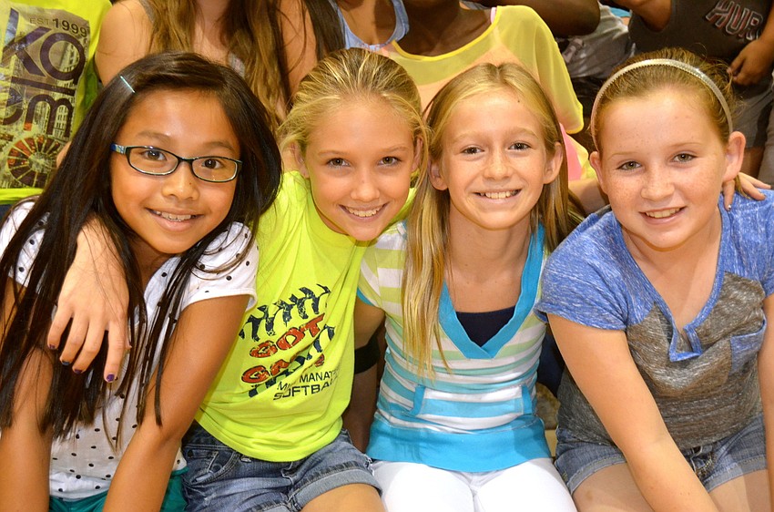 Anna Tran, Julia Thielen, Emily Ridenour and Bailey Jenkins wait for the festivities to start.