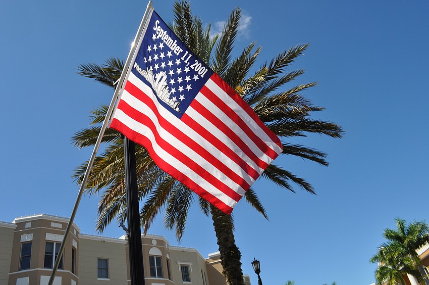 An American flag waves in the sunlight.