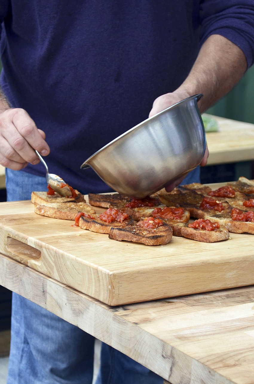 Chef Jose Martinez prepares food for guests at Sweetgrass Farms.