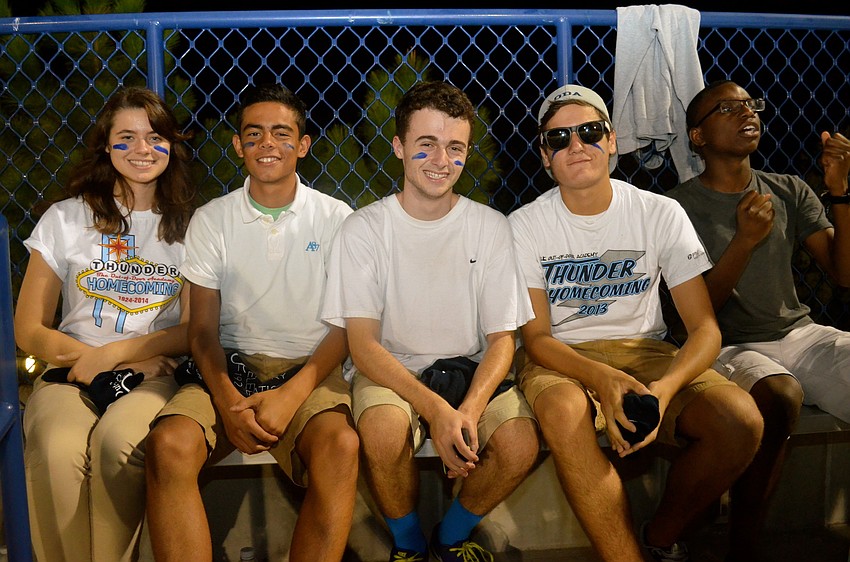 Serenna Jones, Erick PeÃ±a, Aidan Dowdy, Will Harwel and Zach Schandorf cheer from the stands.