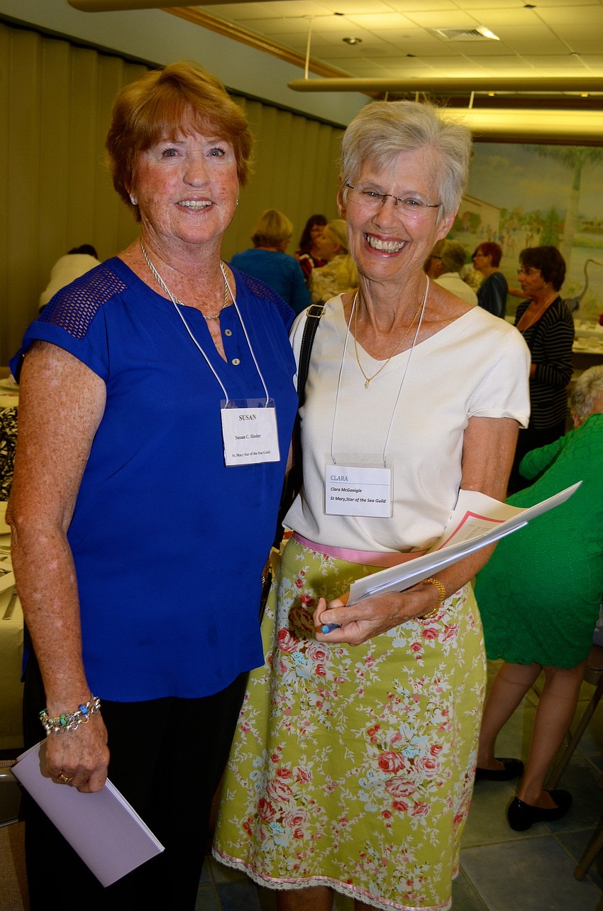 Susan Binder and Clara McGonigle discuss club business.