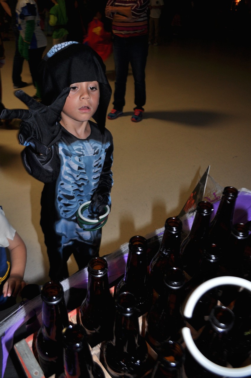 August Ayala, playing a game of ring toss, turned 7 on Oct. 26.