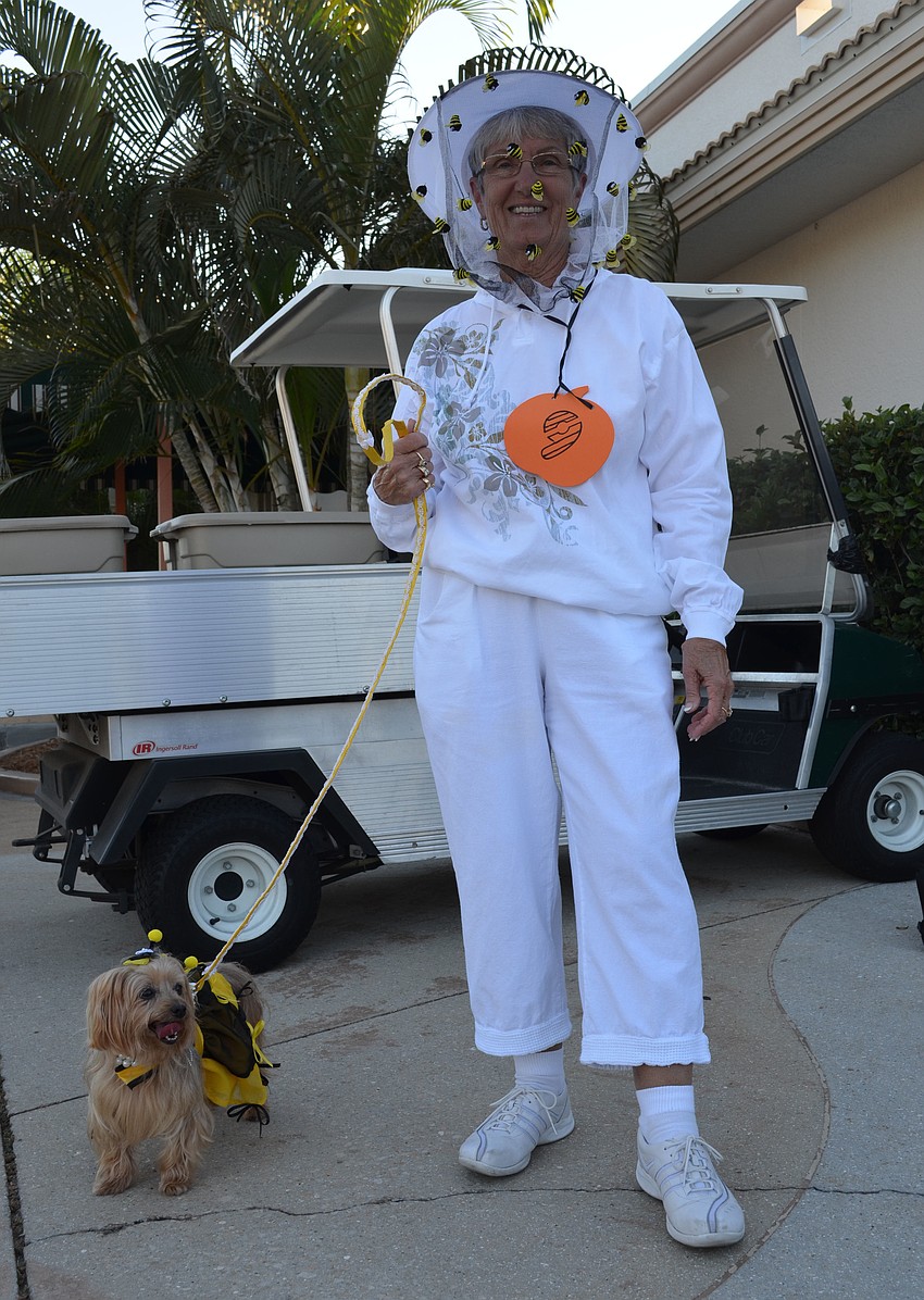 Judy Cowgill dressed as a bee keeper for Missy who is dressed as a queen bee.