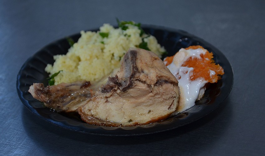 Tuscan braised chicken served with roasted sweet potatoes, Seminole pumpkin and Italian collard greens from the Phillippi Shores Elementary team.